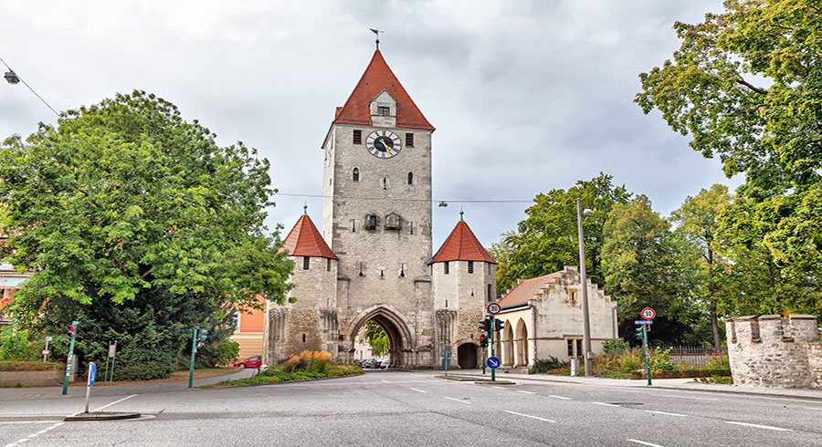 Medieval City Gate With Clock Tower In Regensburg