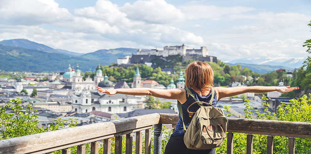 Holiday In Salzburg: Young Girl Is Enjoying The View. Historic D