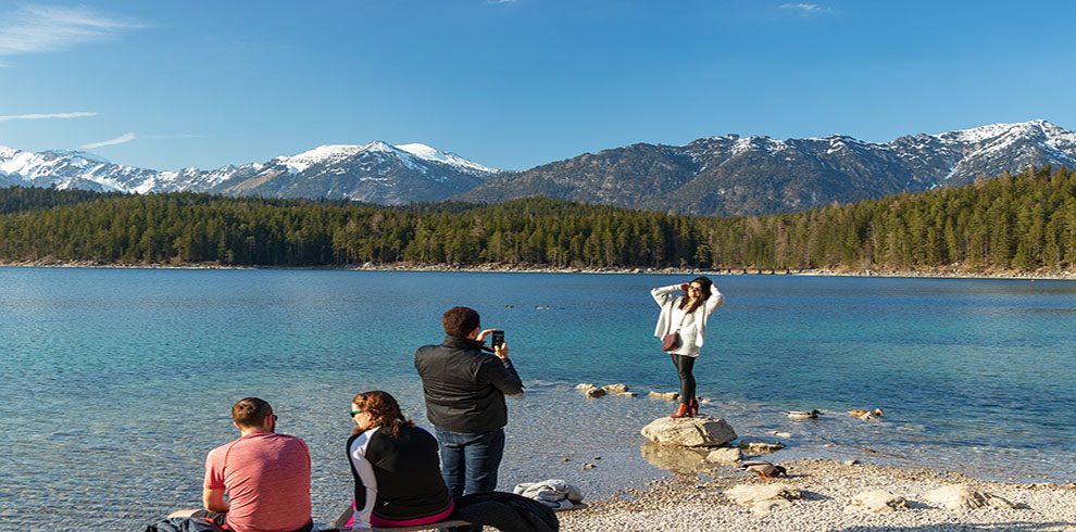 Eibsee, Germany, March 31, 2019: Husband Taking Selfie Of His Wi
